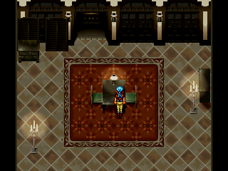 Anabelle alone in a room. She's walking over to a small table with two chairs and a lamp on it.
