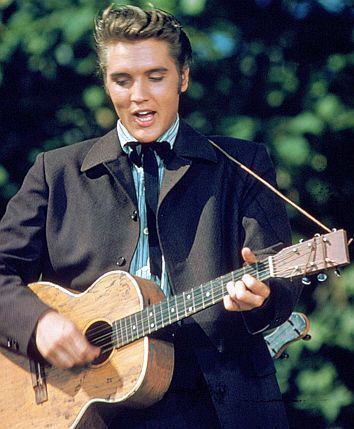 http://i53.photobucket.com/albums/g64/PoorOldSpike/elvis-guitar_zps415a5488.jpg~original